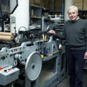 Roger Pertwee with his envelope-making machine

